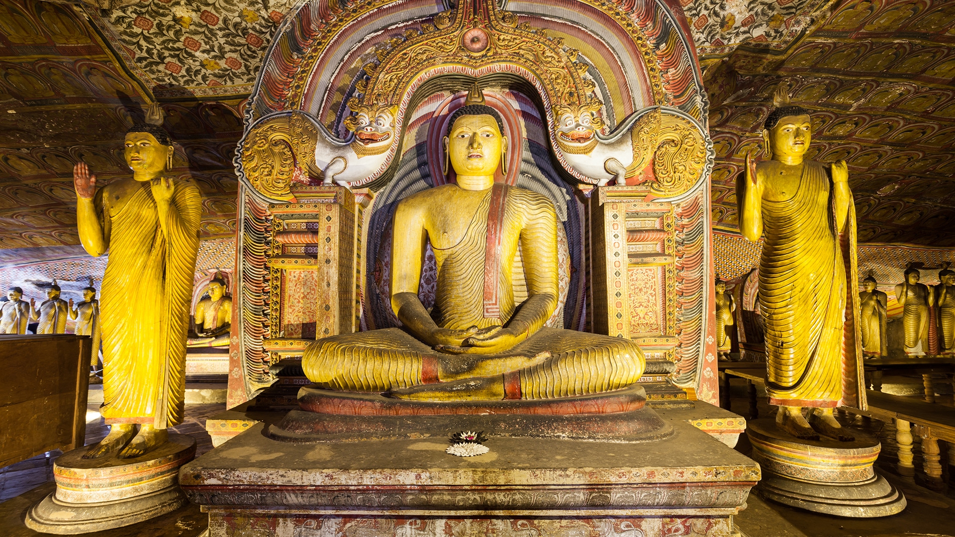 Three Buddha statues from within the Dambulla Cave