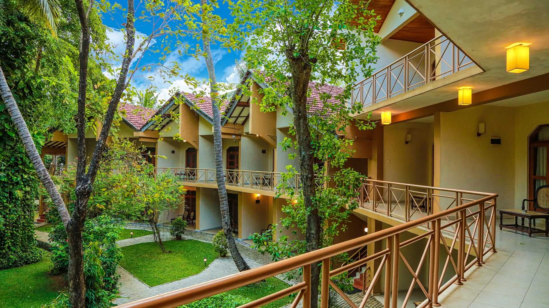 Exterior of a row of rooms at Oakray Pelwehera Village Resort Dambulla 