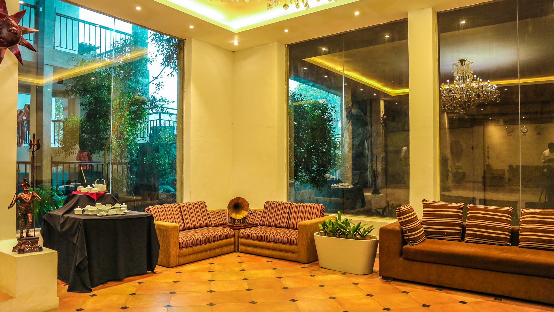 Seating area decorated with beige/brown hues with a tea station at Oak Ray Ella Gap Ella