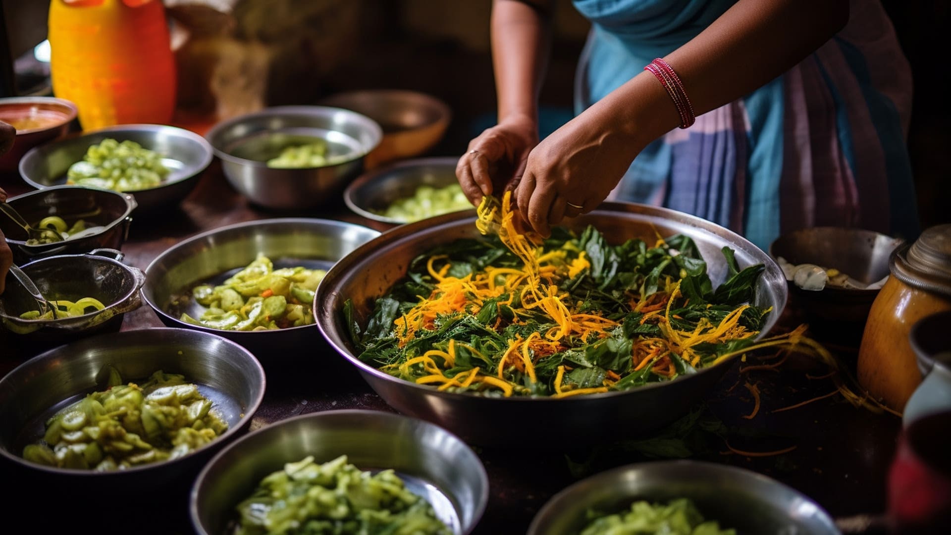 A woman garnishing a bed of leaves while being surrounded by chopped vegetables