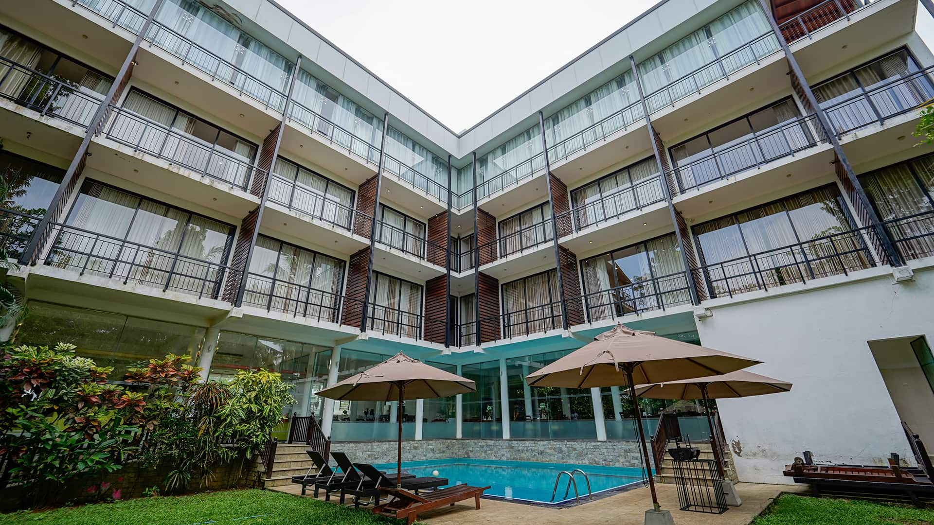 Exterior overview of the rooms and the pool area at Raintree by Oak Ray Tissamaharama