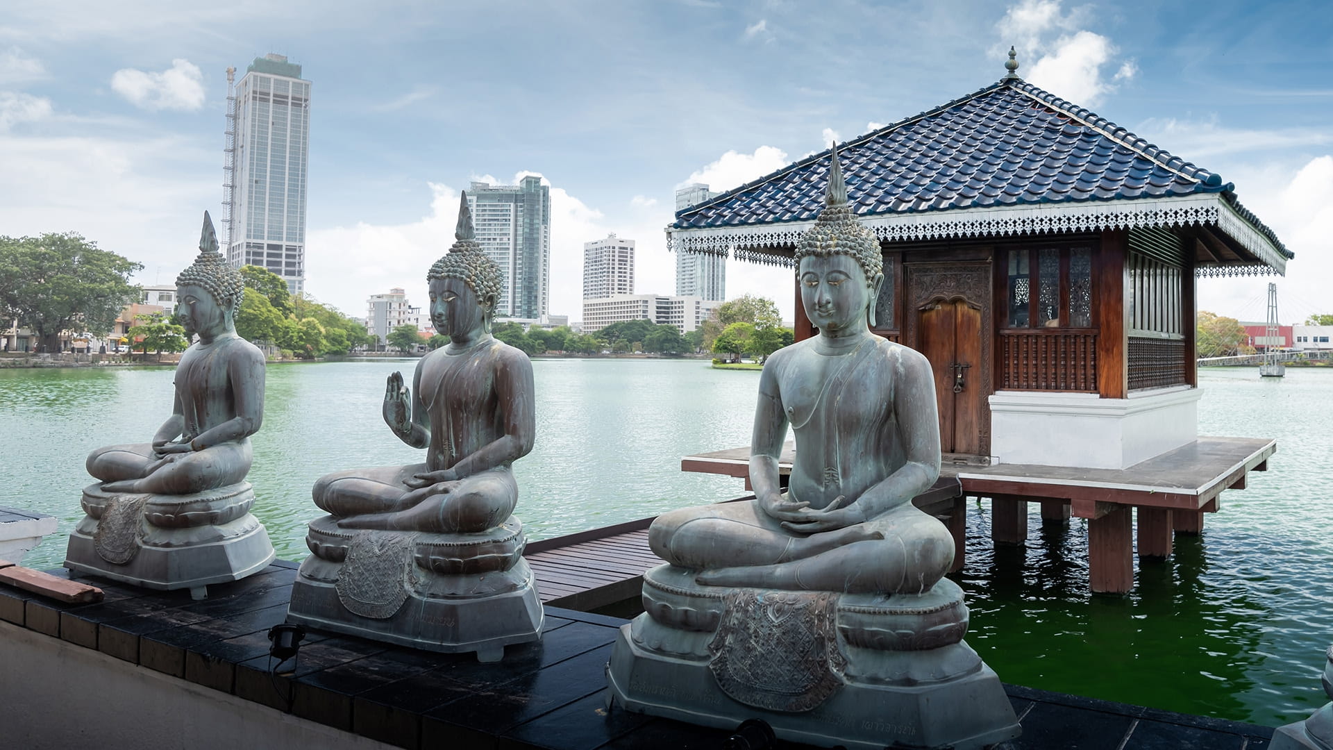 Three Buddha statues at Gangaramaya temple
