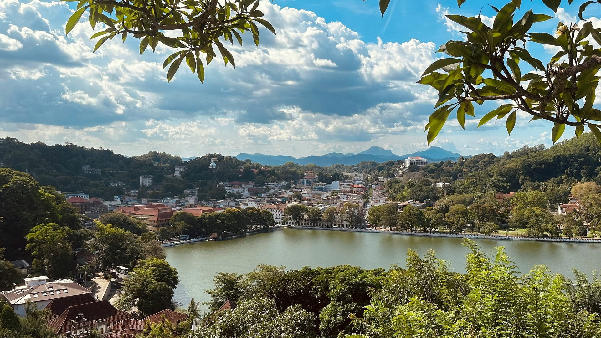View of the scenic Kandy lake and the surrounding area with blue sky